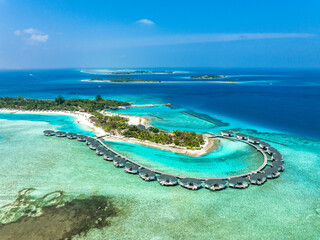 Water bungalows on Kanuhura island resort at Indian Ocean in Maldives