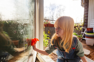 Redhead girl doing housework at apartment