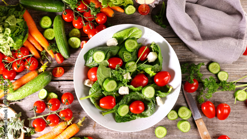 Sticker mixed vegetable salad with spinach,  tomato and cucumber- healthy eating vegetarian food