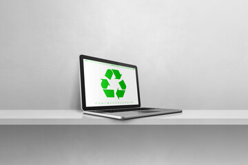 Laptop computer on a shelf with a recycling symbol on screen. environmental conservation concept