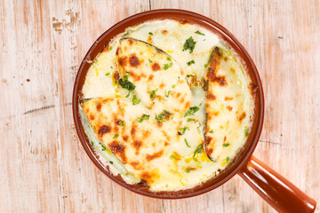 Baked Mussels jibin served in dish isolated on background top view of arabic seafood special
