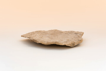 Stone podium for cosmetic product presentation. Abstract minimal backdrop. One rock form. Beige Nude Studio Background. Scene to show. Showcase display case. 3D Front View. Trendy neutral color. Space