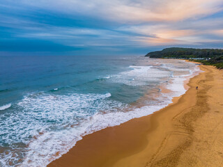 Aerial sunrise at the seaside with cloud cover