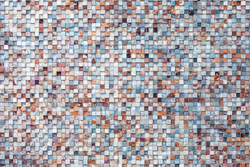 Abstract patterned wall made of small square stones