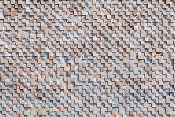 Abstract patterned wall made of small square stones