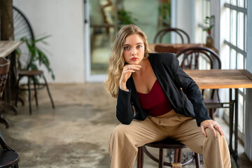 A beautiful young woman posing for a photo in a cafe lifestyle photography concept