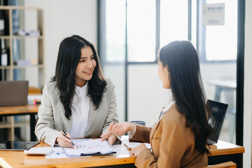Portrait of success business people working together in home office. Couple teamwork startup concept..