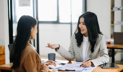 Portrait of success business people working together in home office. Couple teamwork startup concept..