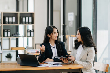 Portrait of success business people working together in home office. Couple teamwork startup concept..
