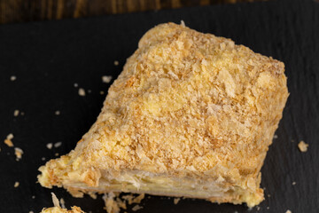 delicious piece of cake with puff pastry and sweet cream