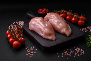 Pieces of raw chicken or turkey fillet with salt, spices and herbs