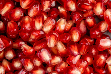 Peeled red pomegranate with ripe grains