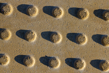 Fototapeta na wymiar part of concrete anti-slip tiles with bulges