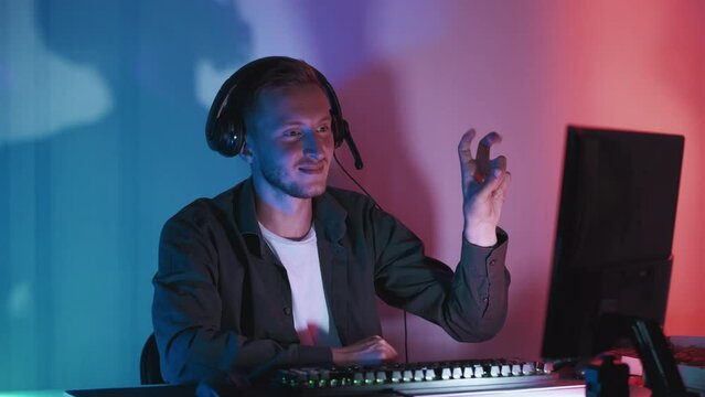 Night entertainment. Peace gesture. Smiling man showing victory sign seamless loop communicating with followers cyber teammates greeting dark neon light room. Generative AI