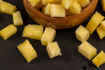 sliced ripe yellow pineapple, a large number of pieces