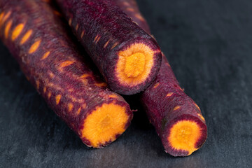 Sliced purple-orange carrots on the table