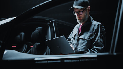 Portrait of a Dealership Car Mechanic Analyzing Diagnostics Results on a Modern Electric Vehicle....