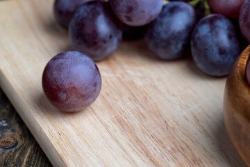Harvested blue grapes on the table