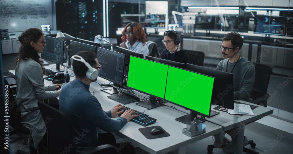 Aufkleber Group of Diverse Multicultural Men and Women Working on Desktop Computers in a Research Center. Young Software Developer Working on a Computer with Two Green Screen Mock Up Displays