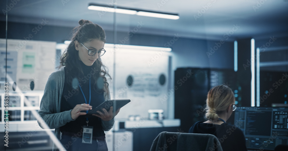 Poster Technological Software Engineering Department Manager Walking and Using a Tablet Computer. Multiethnic Female Working in the Office