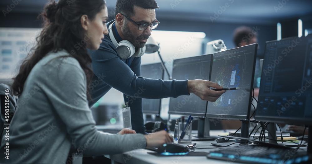 Poster Team Leader Having a Conversation with a Female Software Engineer. Team Working on an Artificial Intelligence Neural Network. Colleagues Mapping Out Issues in a Digital Big Data Visualization Diagram