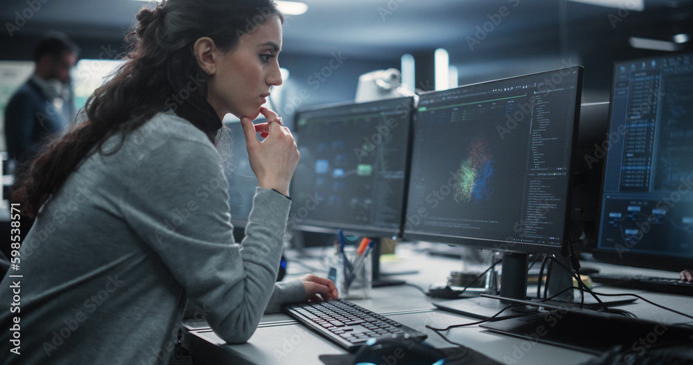 Aufkleber Portrait of a Thoughtful Young Engineer Working on Computer in a Technological Office Environment. Beautiful Multiethnic Woman Writing Software Code for a Blockchain Project