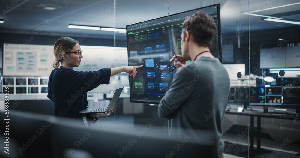 Poster Two Diverse Software Developers Having a Meeting in a Conference Room. Female and Male Tech Industry Engineers Brainstorming Ideas for Their Neural Network Blockchain Startup