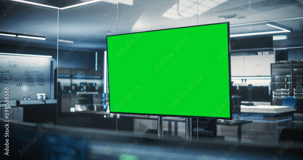 Aufkleber empty meeting conference room with green screen mock up tv display. establishing shot in a technolog