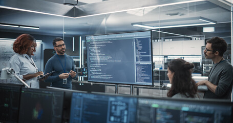 Team of Diverse Software Developers Having a Meeting in Order to Review the Code Done by Computer...