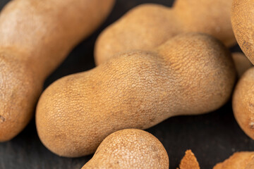 long ripe tamarind pods close up