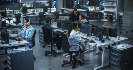 Diverse Young Indian Colleagues Working on Computers in a Research Laboratory. Focus on Female...