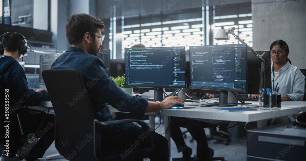 Fototapete Team of Talented Young Indian Professionals Working in a Technological Research and Development Agency. Computer Screens with Software Code and Technical Neural Network Diagrams