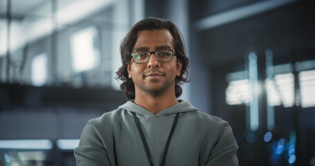 Portrait of a Talented Indian Man Looking at Camera and Lightly Smiling. South Asian Startup...