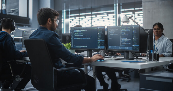 Team of Talented Young Indian Professionals Working in a Technological Research and Development Agency. Computer Screens with Software Code and Technical Neural Network Diagrams
