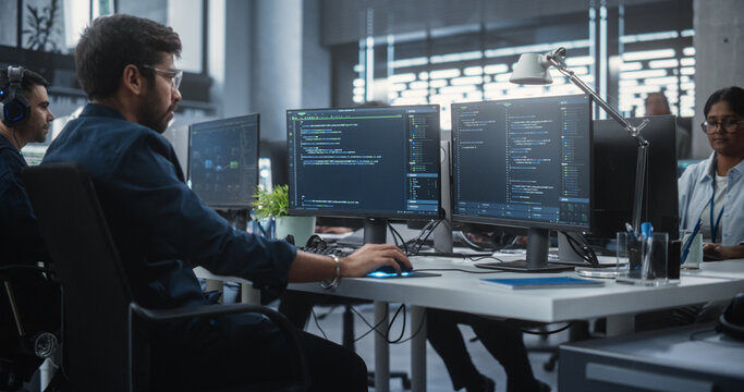 Team of Talented Young Indian Professionals Working in a Technological Research and Development Agency. Computer Screens with Software Code and Technical Neural Network Diagrams