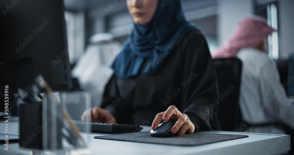 Aufkleber Close Up of a Middle Eastern Engineer Working on Computer in a Technological Corporate Office. Young Muslim Woman Writing Software Code for an Innovative Internet and Software as a Service Project