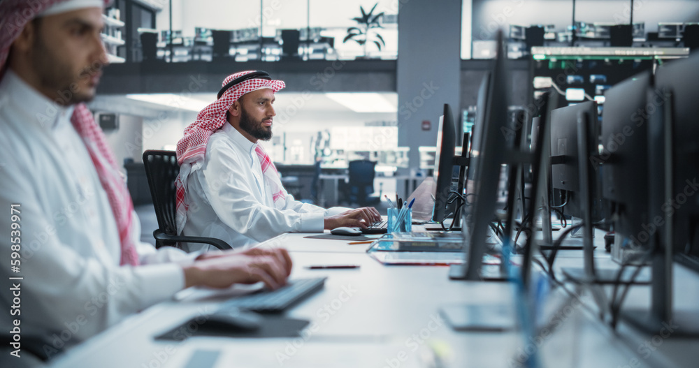 Aufkleber Middle Eastern Engineer Working on Desktop Computer in a Technological Corporate Office. Manager Working with Colleagues on Innovative Internet and Software as a Service Project