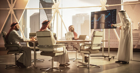 Saudi Operations Manager Delivering a Successful Presentation About a Lucrative Business Merger...