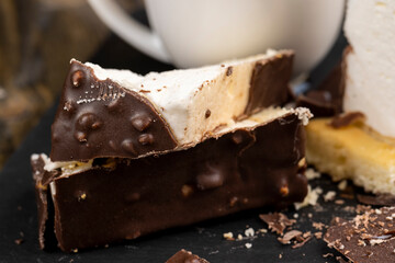 Fresh sweet cake with milk taste and aroma in chocolate glaze