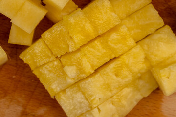 sliced ripe yellow pineapple, a large number of pieces
