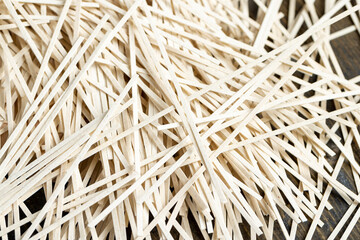 thin rice flour noodles on the table, close up