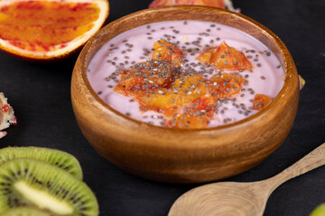 fresh yogurt with berries and fruits with red oranges