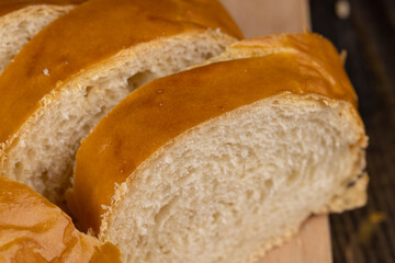 Wheat baguette on a wooden cutting board