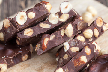 large pieces of milk chocolate with roasted hazelnuts