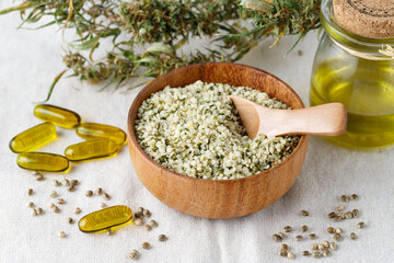 Shelled hemp seeds and oil as superfoods, supplement for eat with fiber and omega 3. Crushed...