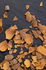 the shell of the peeled tamarind fruit on the table