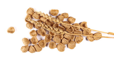Orecchiette pasta uncooked and ear of wheat isolated on white, top view