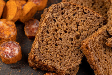 pieces of black rye bread from mixed wheat flour with rye flour