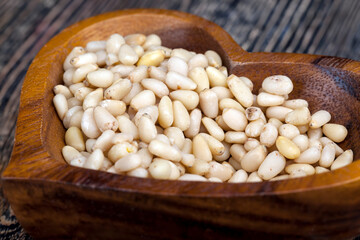 peeled pine nuts close-up on the table