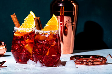 Negroni mezcalito cocktail drink with mexican mezcal, vermouth, bitter, herbal liqueur, orange,...